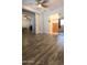 Primary bedroom showing walk-in closet, ceiling fan and wood-look floors at 921 S Val Vista Dr # 28, Mesa, AZ 85204