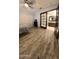 Bedroom featuring wood-look floors, ceiling fan, a window and attached bathroom at 921 S Val Vista Dr # 28, Mesa, AZ 85204