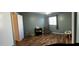 Cozy bedroom features laminate flooring and ample natural light at 921 S Val Vista Dr # 28, Mesa, AZ 85204