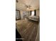 Spacious bedroom with wood-look flooring and a ceiling fan at 921 S Val Vista Dr # 28, Mesa, AZ 85204