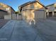 Charming home featuring a detached garage with a spacious driveway and a gated entrance at 921 S Val Vista Dr # 28, Mesa, AZ 85204