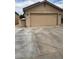 Exterior view of attached two-car garage and concrete driveway at 921 S Val Vista Dr # 28, Mesa, AZ 85204