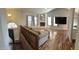Spacious living room with a fireplace, and vaulted ceilings with ceiling fan and wood-look floors at 921 S Val Vista Dr # 28, Mesa, AZ 85204