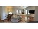 Spacious living room with a fireplace, and vaulted ceilings with ceiling fan and wood-look floors at 921 S Val Vista Dr # 28, Mesa, AZ 85204