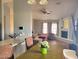 Open concept living room with hardwood floors, a fireplace, and lots of natural light at 921 S Val Vista Dr # 28, Mesa, AZ 85204
