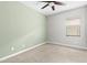 Spacious bedroom featuring neutral carpet, window, ceiling fan, and a two-tone paint scheme at 9728 E Twinkle Ave, Mesa, AZ 85212