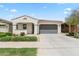 Charming single-story home featuring a well-manicured lawn, neutral color palette, and a two-car garage at 9728 E Twinkle Ave, Mesa, AZ 85212