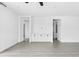Bright living space with white cabinets and decor, neutral walls and light wood-look flooring at 9728 E Twinkle Ave, Mesa, AZ 85212
