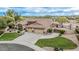 A well landscaped home with a 3-car garage, pool, sport court and putting green at 11511 E Chestnut Ct, Chandler, AZ 85249