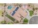 An aerial shot highlights this property's pool, sport court, putting green, patio, and solar panels at 11511 E Chestnut Ct, Chandler, AZ 85249
