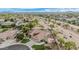 Aerial view of the property featuring a pool, sport court, lush landscaping, and solar panels at 11511 E Chestnut Ct, Chandler, AZ 85249