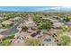 Aerial view showcasing the backyard pool/spa, sports court and putting green of this desert home at 11511 E Chestnut Ct, Chandler, AZ 85249