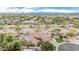 A beautiful aerial view of this landscaped home with a 3-car garage, pool, and sport court at 11511 E Chestnut Ct, Chandler, AZ 85249