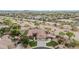 Aerial view of the property featuring a sport court, landscaping, and desert surroundings at 11511 E Chestnut Ct, Chandler, AZ 85249