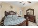 Elegant bedroom features a carved wood bed frame and matching dresser with ornate mirror at 11511 E Chestnut Ct, Chandler, AZ 85249