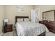 Bedroom boasts a matching bed and dresser set, neutral walls, and carpet, with an open doorway at 11511 E Chestnut Ct, Chandler, AZ 85249