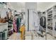 Spacious walk-in closet with custom shelving and ample storage space for clothes and accessories at 11511 E Chestnut Ct, Chandler, AZ 85249