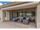 Inviting covered patio features stylish seating, perfect for outdoor relaxation and entertaining at 11511 E Chestnut Ct, Chandler, AZ 85249
