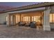 Inviting covered patio features stylish seating, perfect for outdoor relaxation and entertaining at sunset at 11511 E Chestnut Ct, Chandler, AZ 85249