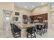 Open kitchen with a large island, granite countertops, and stainless steel appliances at 11511 E Chestnut Ct, Chandler, AZ 85249