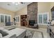 Comfortable living room with stone fireplace, vaulted ceilings, and ample seating at 11511 E Chestnut Ct, Chandler, AZ 85249