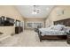Spacious bedroom with neutral walls, large windows, ceiling fan, and carpet flooring at 11511 E Chestnut Ct, Chandler, AZ 85249