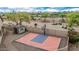 A fenced sport court and storage shed create an active outdoor space on this desert home at 11511 E Chestnut Ct, Chandler, AZ 85249
