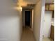 Narrow hallway with access to other rooms in the home at 12231 N 22Nd Ave, Phoenix, AZ 85029