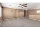 Large bonus room with neutral carpet and ample natural light at 12430 W Scotts Dr, El Mirage, AZ 85335