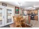 Eat in kitchen featuring tile flooring, stainless steel appliances, and backyard access at 12430 W Scotts Dr, El Mirage, AZ 85335