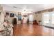 Spacious living room with wood floors, ceiling fan, and French doors to the backyard at 12430 W Scotts Dr, El Mirage, AZ 85335