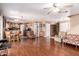 Open-concept living space featuring wood floors connecting living, dining, and kitchen areas at 12430 W Scotts Dr, El Mirage, AZ 85335
