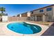 Features a refreshing in-ground pool with clear blue water, set within a fenced backyard at 12430 W Scotts Dr, El Mirage, AZ 85335