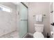 This bathroom boasts a large, marble-tiled shower, frosted glass door, and updated fixtures at 14616 N 28Th Pl, Phoenix, AZ 85032