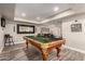 Spacious game room with a well-maintained pool table, perfect for social gatherings at 14616 N 28Th Pl, Phoenix, AZ 85032