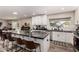 This spacious kitchen features white cabinets, an expansive island, and modern appliances at 14616 N 28Th Pl, Phoenix, AZ 85032