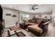 Open concept living room featuring a large sectional sofa and backyard access at 14616 N 28Th Pl, Phoenix, AZ 85032