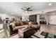 Open-concept living space featuring a large sectional sofa and access to the kitchen, perfect for entertaining at 14616 N 28Th Pl, Phoenix, AZ 85032