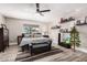 Relaxing main bedroom with wood-look tile floors, neutral paint, and a ceiling fan at 14616 N 28Th Pl, Phoenix, AZ 85032