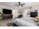 This main bedroom boasts wood-look tile floors and an ensuite bathroom at 14616 N 28Th Pl, Phoenix, AZ 85032
