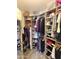 Spacious walk-in closet featuring custom shelving and organization solutions for optimal storage at 15252 N 100 St # 1146, Scottsdale, AZ 85260