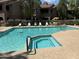 Community pool with spa surrounded by seating and lush landscaping for relaxation at 15252 N 100 St # 1146, Scottsdale, AZ 85260