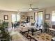 Spacious living room and dining area with plenty of natural light and ceiling fans at 15252 N 100 St # 1146, Scottsdale, AZ 85260