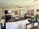 Open-concept living space features decorative fireplace and neutral color palette at 15252 N 100 St # 1146, Scottsdale, AZ 85260