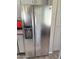 Side-by-side stainless steel refrigerator with water and ice dispenser complements the kitchen at 15252 N 100 St # 1146, Scottsdale, AZ 85260
