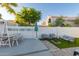 Outdoor living space featuring a dining area, fire pit, and comfortable seating, perfect for gatherings at 16014 S 13Th Way, Phoenix, AZ 85048