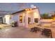 Backyard featuring a covered patio, swimming pool, and lush landscaping, ideal for outdoor living at 16014 S 13Th Way, Phoenix, AZ 85048