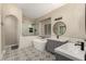 Beautiful bathroom with a soaking tub, walk-in shower, dual sink vanity, and decorative tile flooring at 16014 S 13Th Way, Phoenix, AZ 85048
