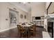 Inviting dining room featuring modern decor and a view to the staircase at 16014 S 13Th Way, Phoenix, AZ 85048