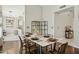 Dining room featuring a sleek table setting with seating for six and a modern shelving unit at 16014 S 13Th Way, Phoenix, AZ 85048